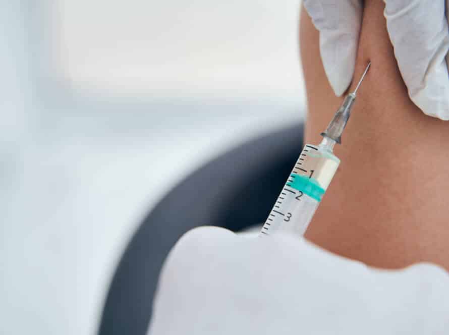 Focused photo on syringe doing covid vaccination